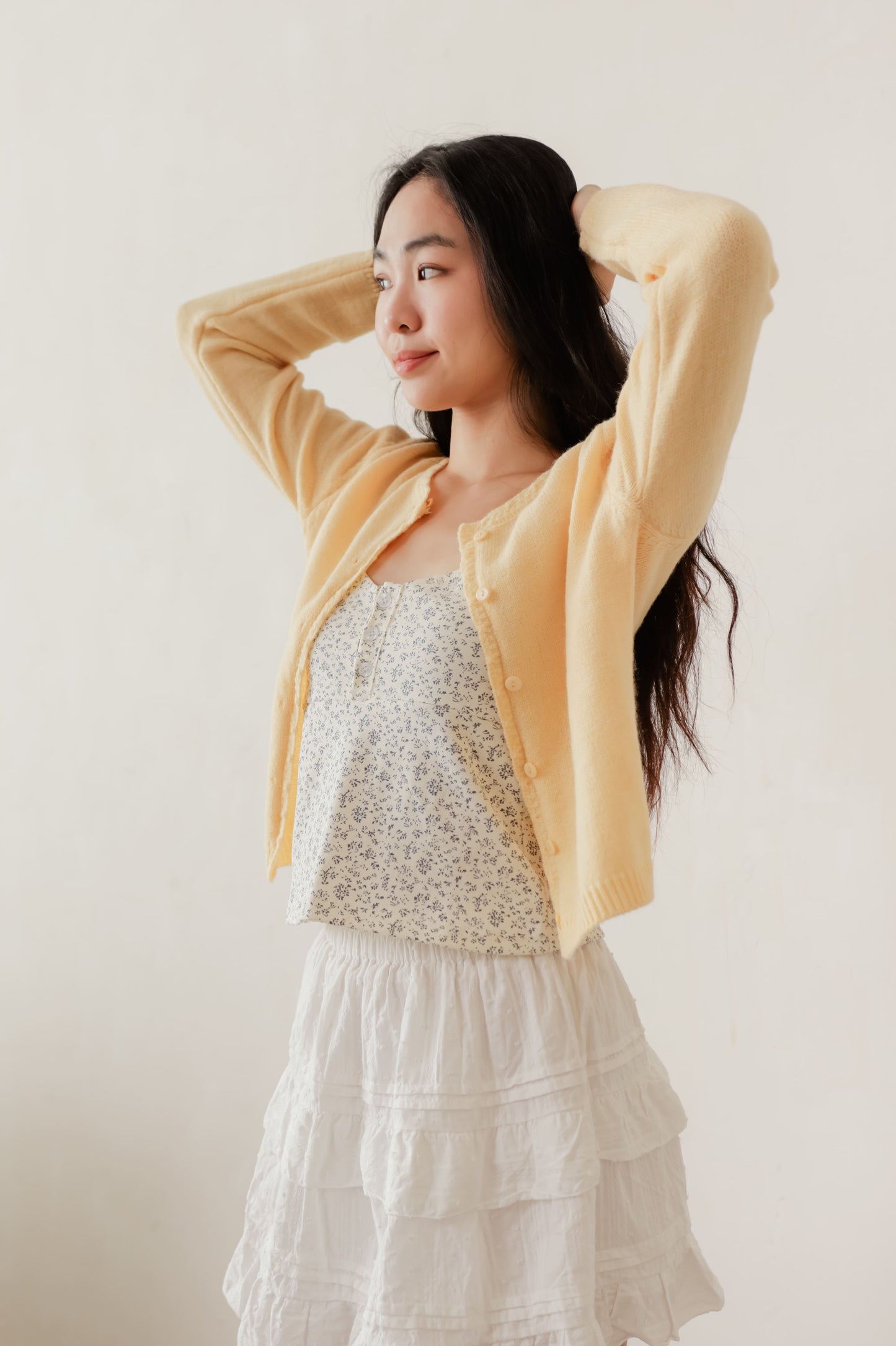 Yellow Candy cardigan with soft knit texture and contrast buttons – playful layering piece for everyday wear