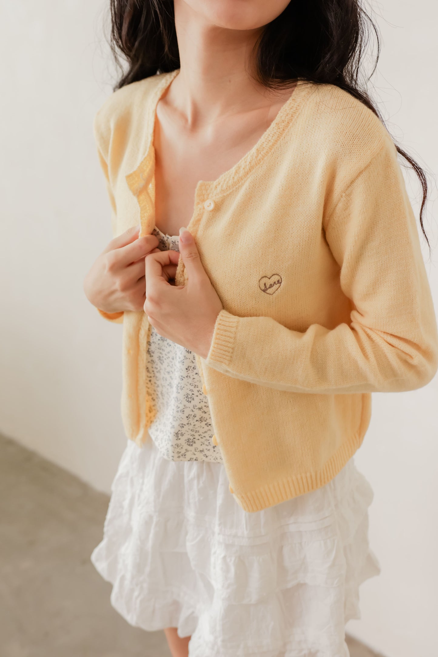Yellow Candy cardigan with soft knit texture and contrast buttons – playful layering piece for everyday wear