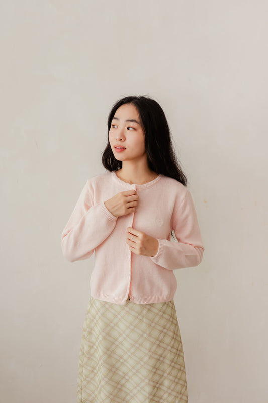 Pink Candy cardigan with soft knit texture and contrast buttons – playful layering piece for everyday wear
